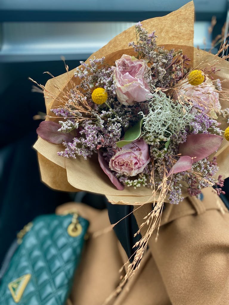 A beautiful floral bouquet featuring pastel roses and mixed flowers, perfect for romantic occasions.