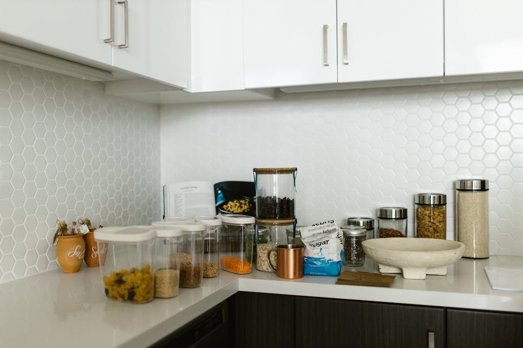 A neatly organized kitchen counter with various food storage containers.
